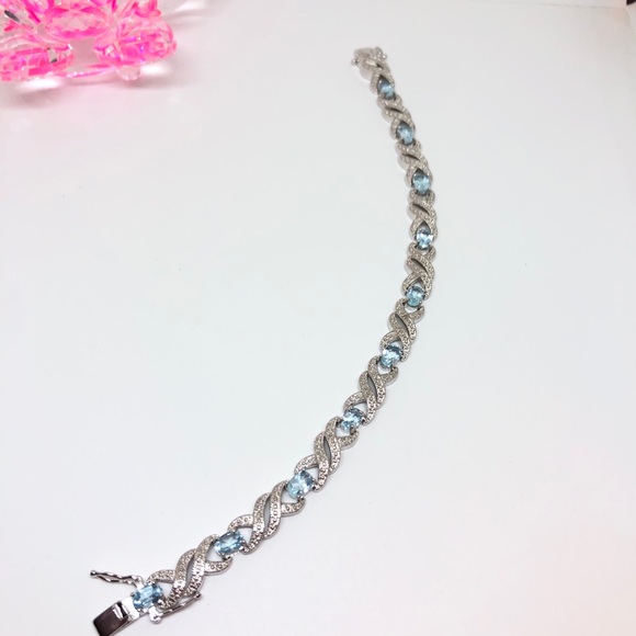 Rhodium Plated Blue Topaz Infinity Bracelet - Picture 5 of 11